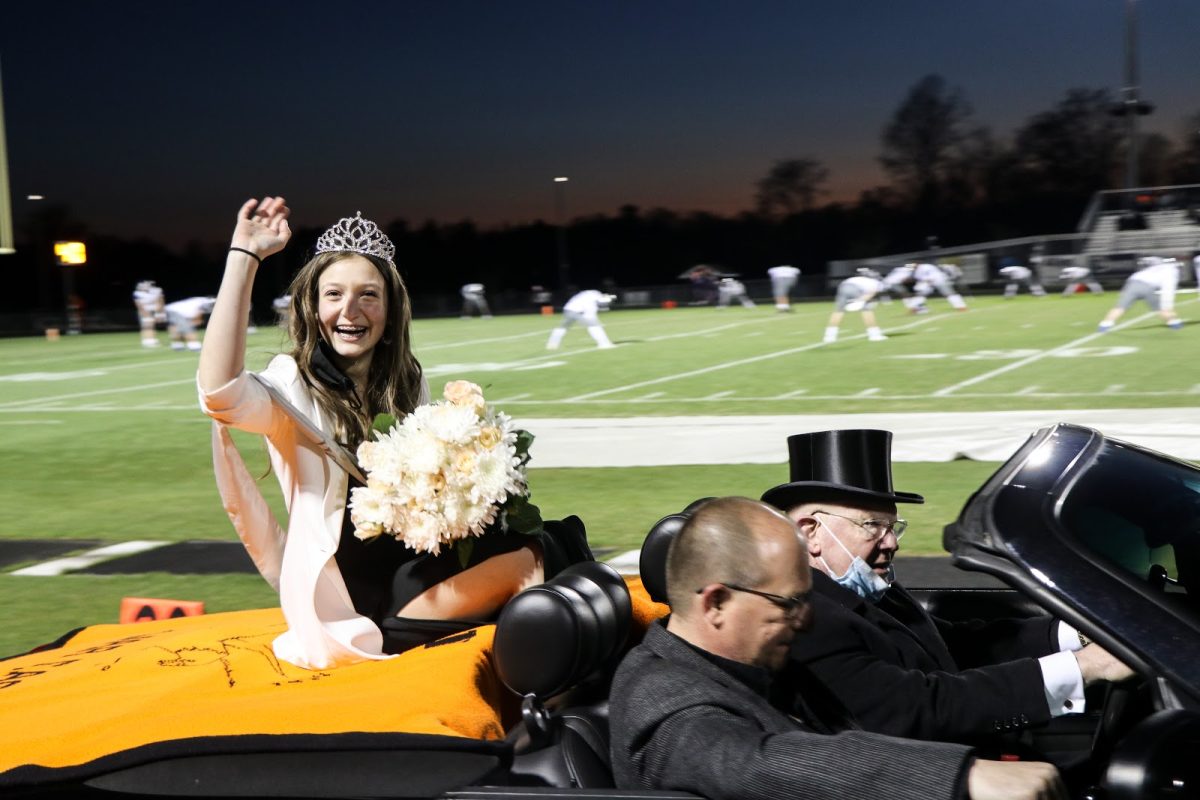 Ashley Butero, our 2020-2021 Homecoming Queen, taking her victory lap around the track