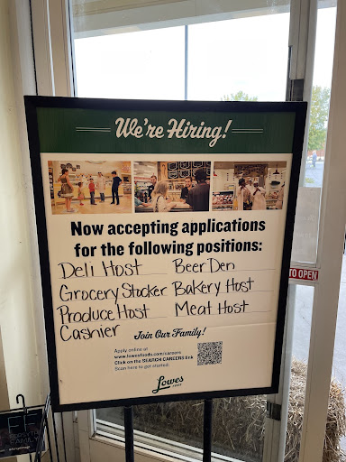 A help-wanted sign sits outside Lowe's Foods in Davie County, North Carolina.