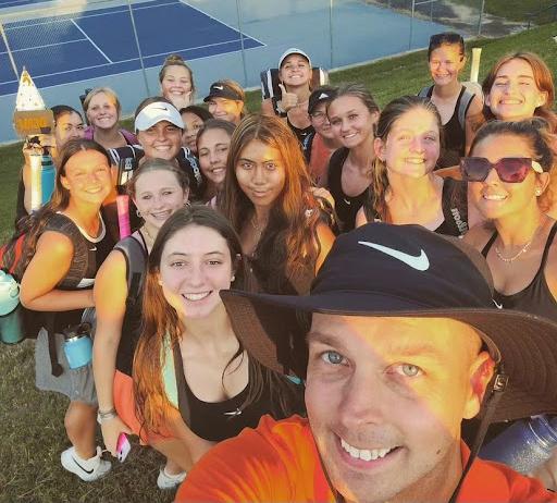 The Davie High Women’s Tennis Team poses for a picture moments after their 30th win in a row, breaking the school record.

Photo by Collin Ferebee