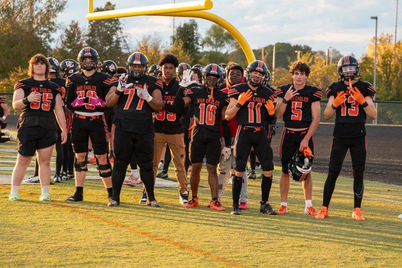 Grayson Cayton, Evan Froelich, Jalen Alexander, Braxton Bowling, Elliott Gould, Gavin Reese, and Grey Deal line up for a picture before the game. 