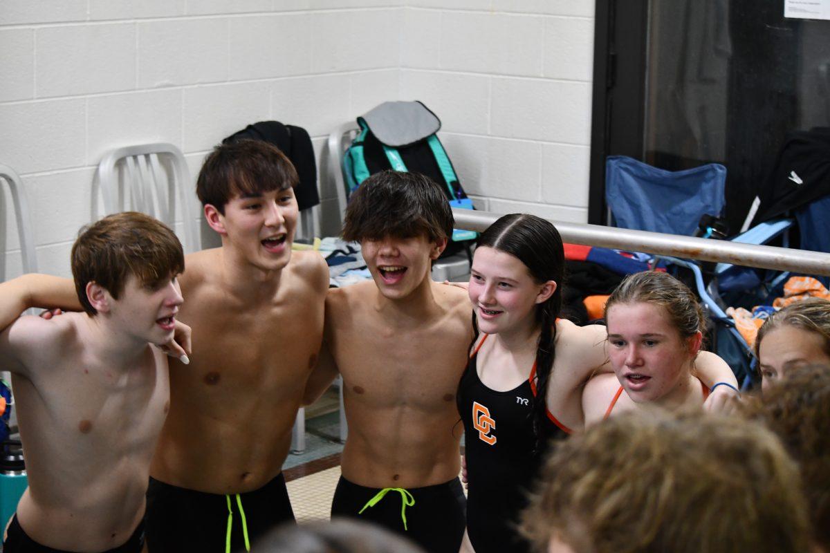 Pictured is the Davie High Swim Team saying their chant before the meet began