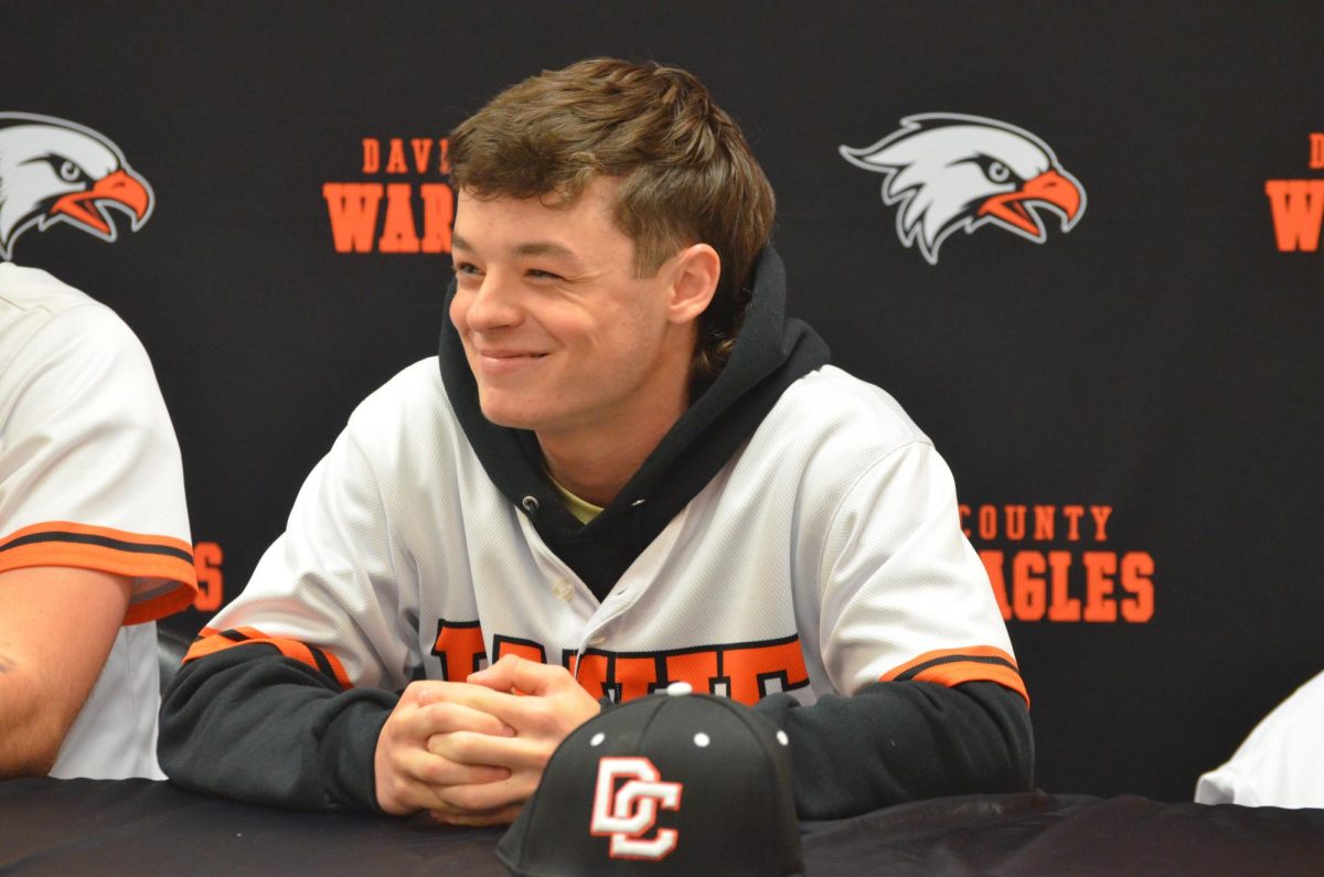 Junior Parker Davis responds to interview questions at baseball's sports media day.