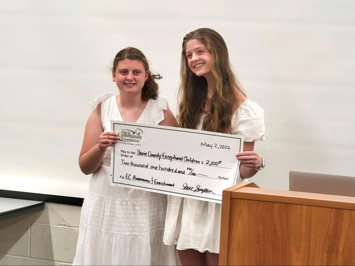 Senior Brooklyn Lakey receives a Grant from the SURF Board for the EC Program in Davie County alongside her sister Annabelle Lakey.