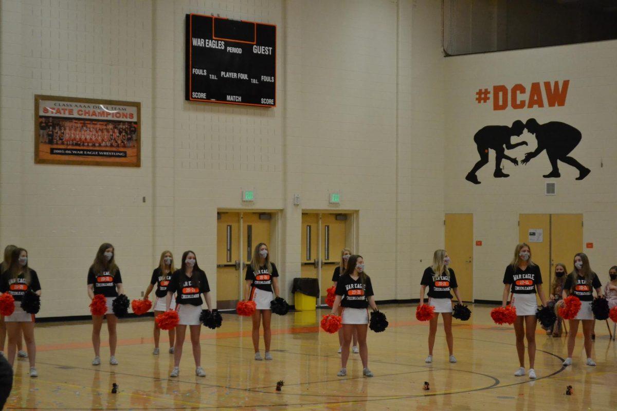 The cheerleaders bring spirit to the event.