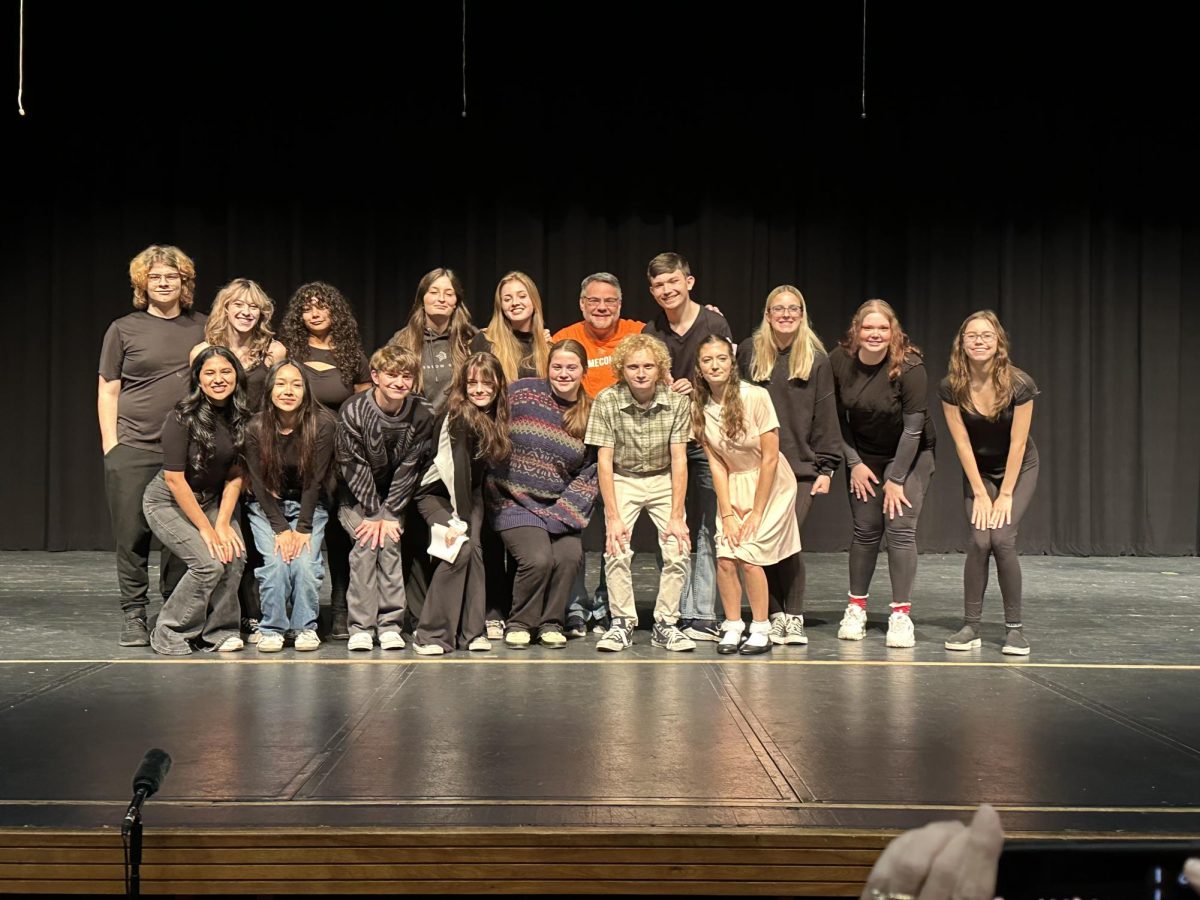 The Davie Players pose with theater teacher Chad Edwards on stage at the North Carolina Theater Conference Regional competition. Photo courtesy of Chad Edwards