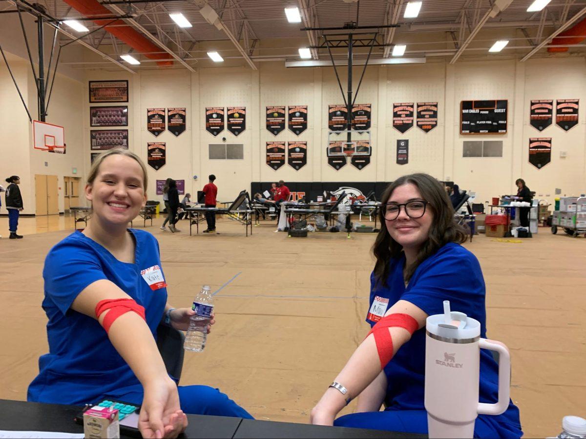 Kate Wilson and Mary Jordan, health science students, volunteer and donate blood at the blood drive.