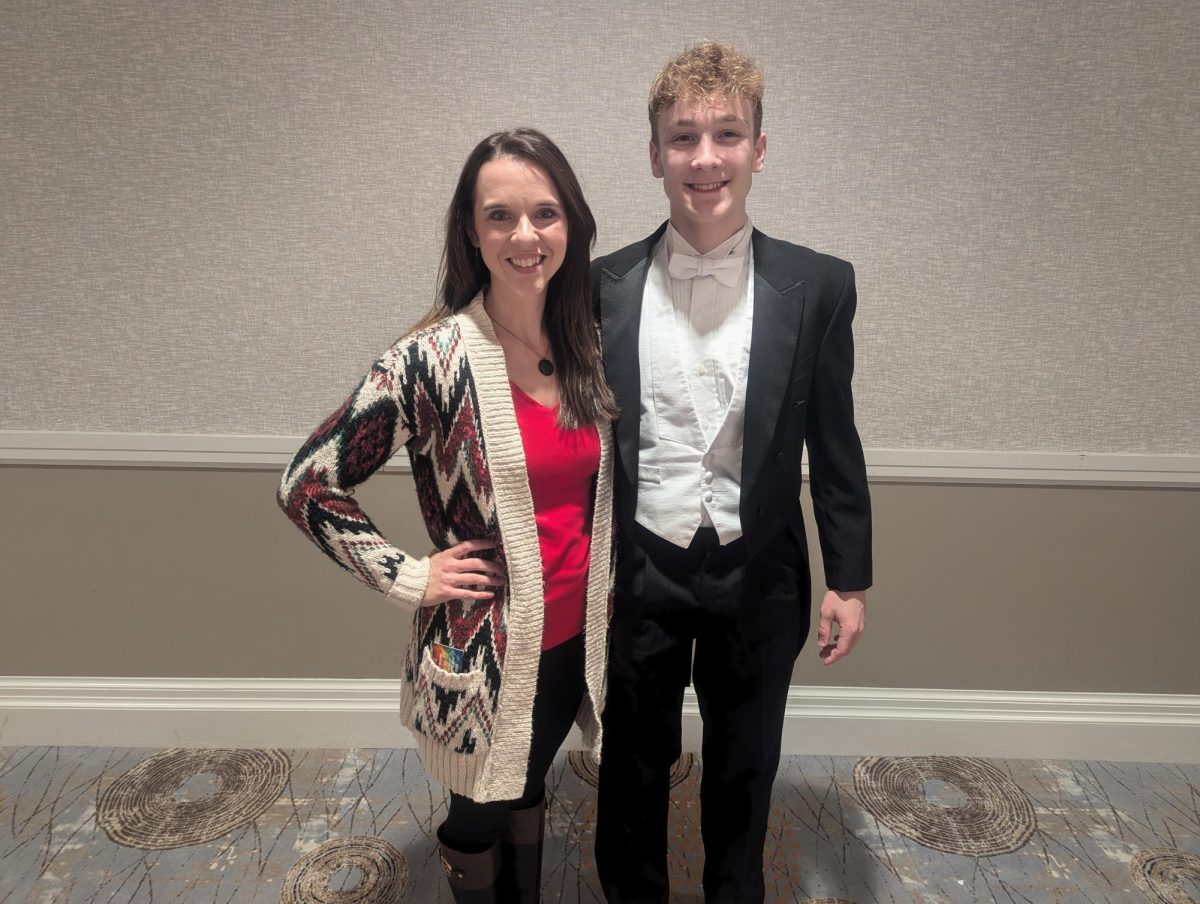 Andy Davis poses with chorus teacher Brittany Darst at the North Carolina Honors Chorus