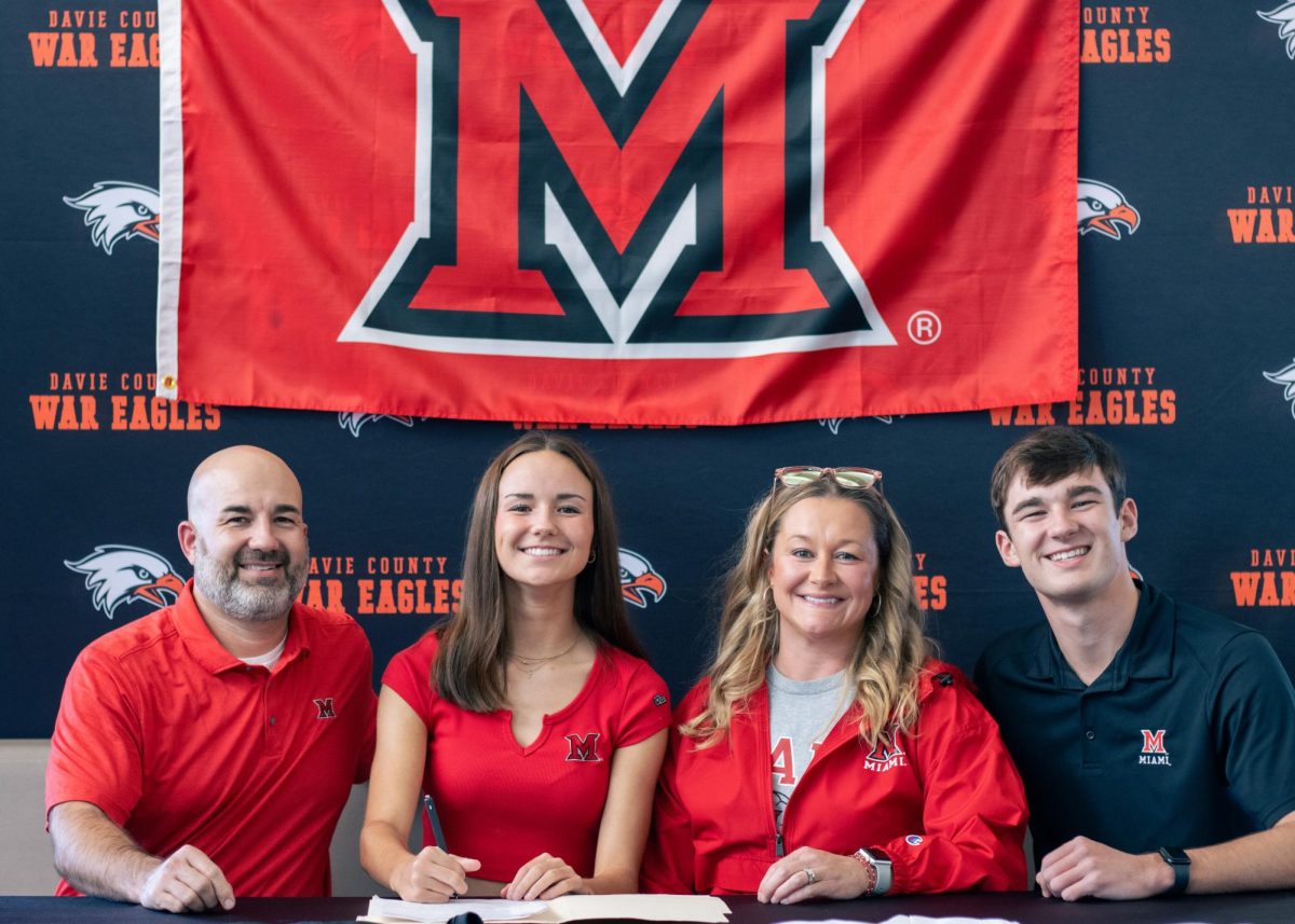 Jaden Sink poses with her parents and brother at her signing ceremony on Tuesday, November 26.