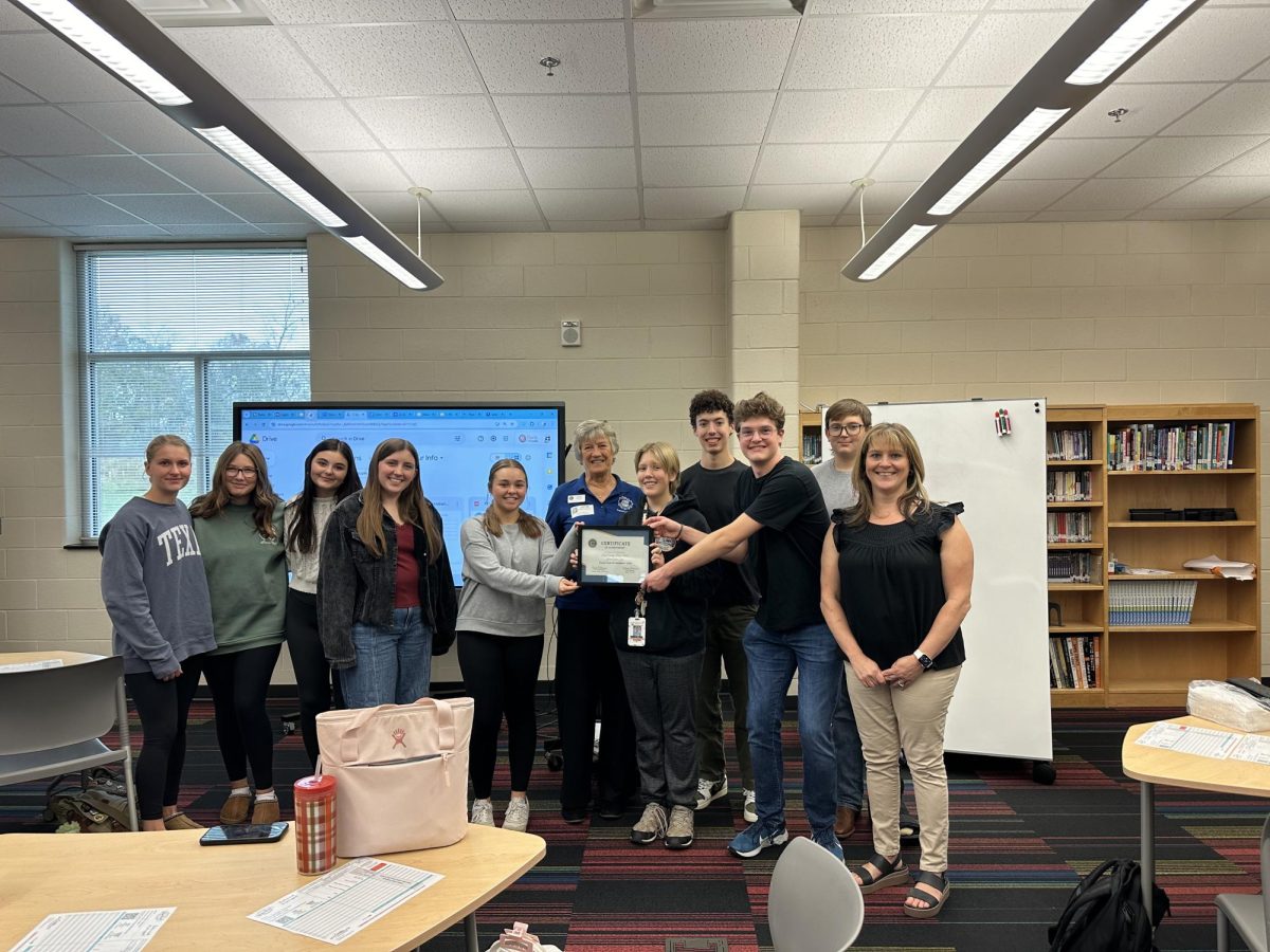 Junior Civitans leadership poses with Dr. Cyndi Osterhus, the Junior Civitan Chair of Region 3. who presented the club with their official certificate recognizing them as an Honors Club of Distinction.