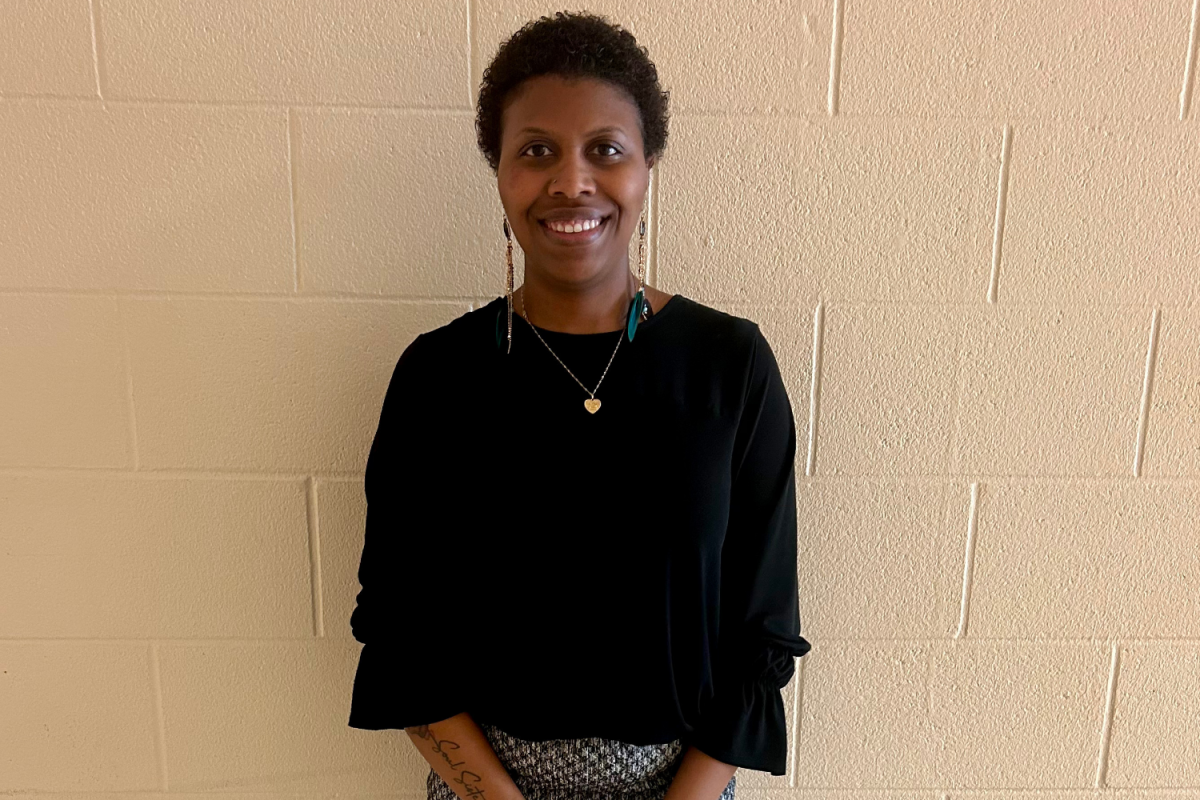 Tanicia Jackson poses for a photo outside her classroom.