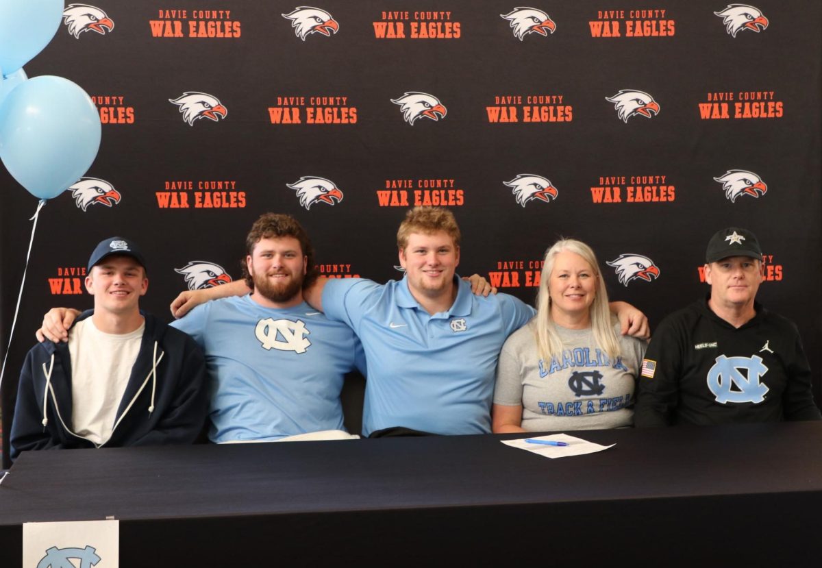 Cooper Williams (center) poses with his family at his signing ceremony for UNC Chapel Hill on January 8, 2025.