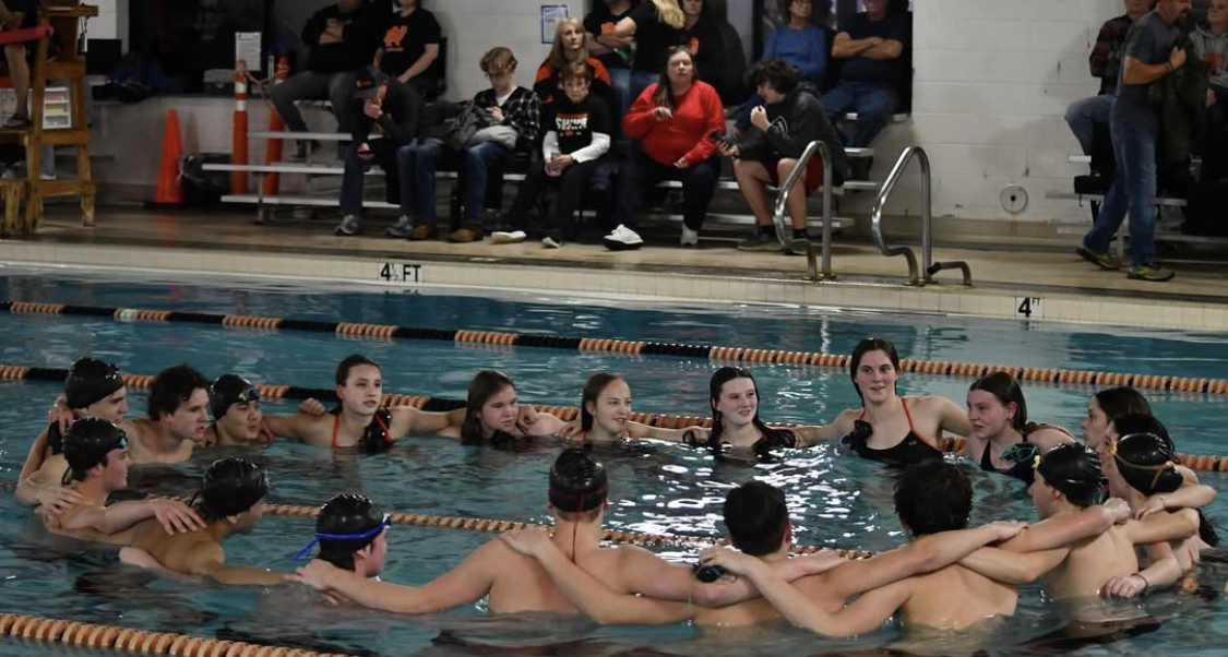 The Davie High Swim Team starts off their meet with a signature team cheer.