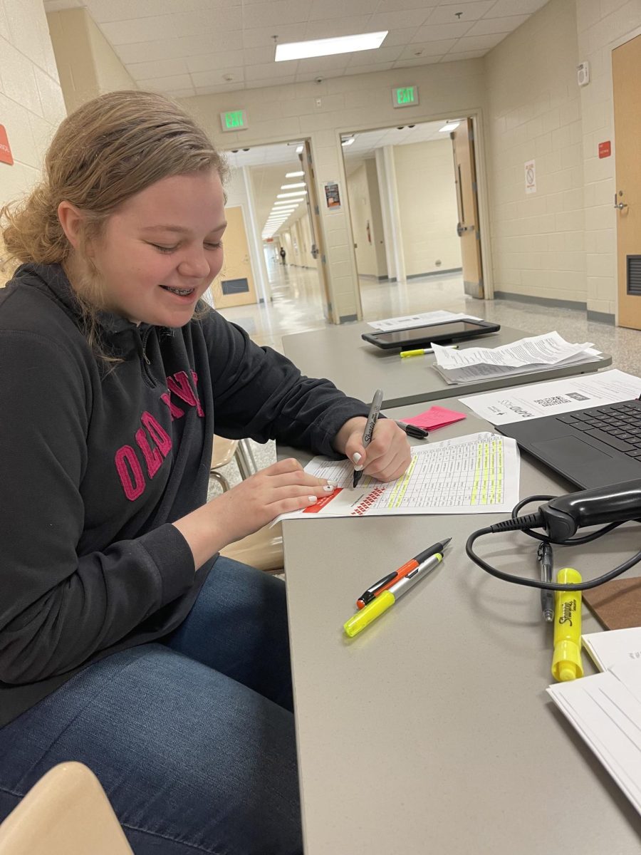 Annaleigh Deel completes paperwork at the Valentine's Day Blood Drive sponsored by Davie's Health Science classes.