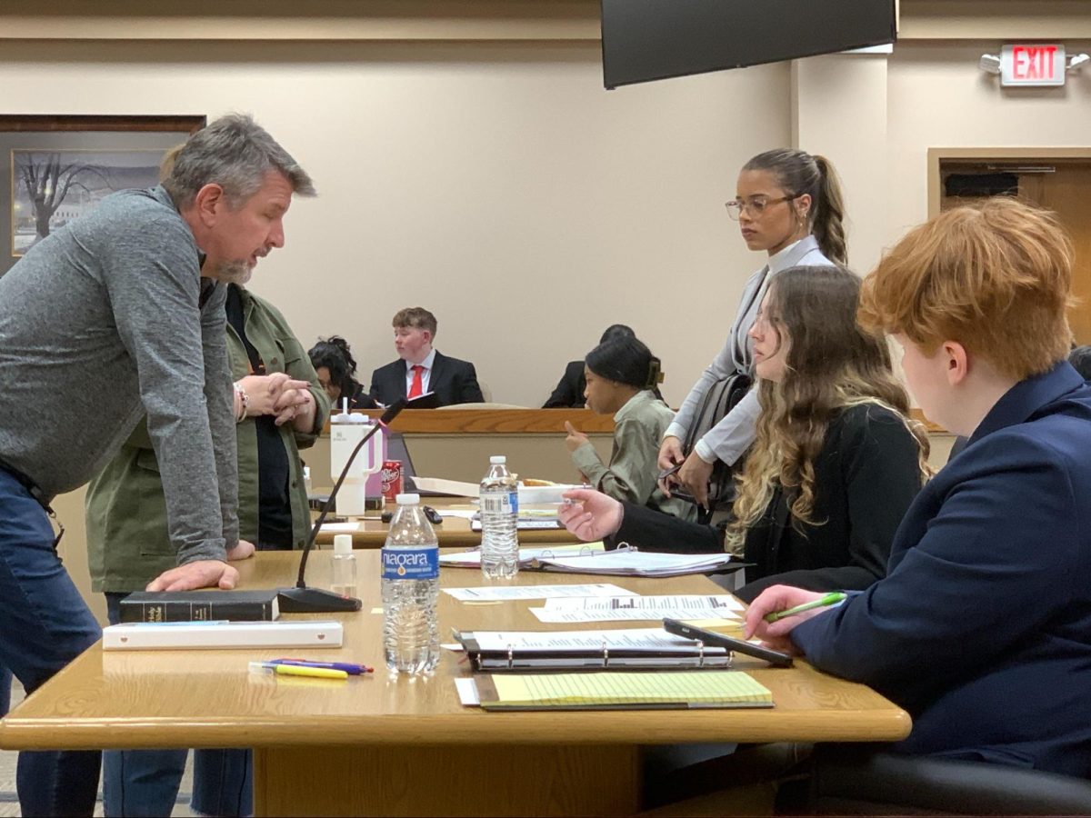 Judge Carlton Terry advises the plaintiff at the team’s dress rehearsal at the Davie County Courthouse the night before the regional competition.