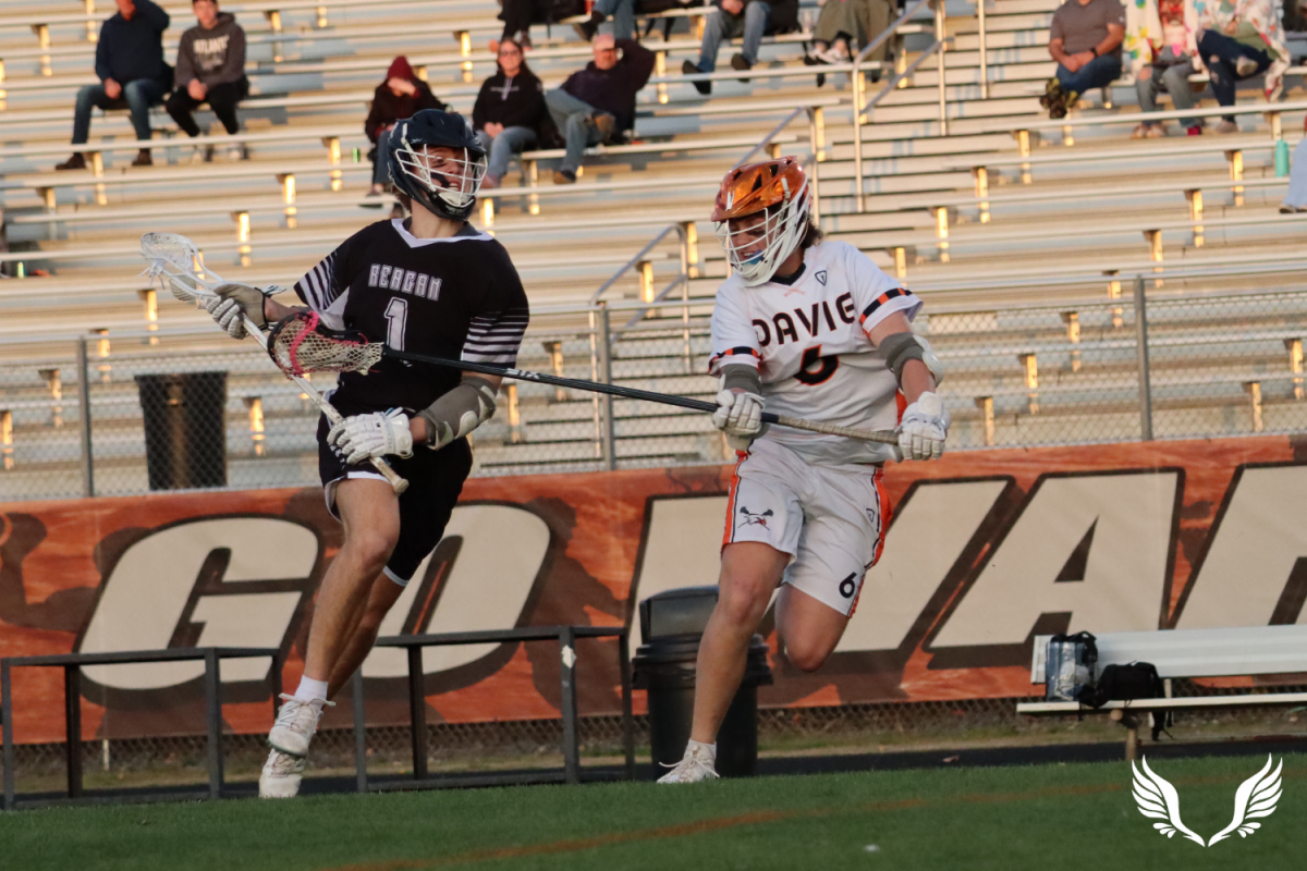 Sophomore Evan Helms defends against a play against Reagan High School.