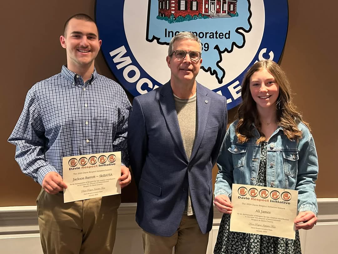 DRI awardees Jackson Barrett and Ali James receiving their awards at a ceremony with Mocksville Mayor Will Marklin. | Photo courtesy Davie Respect Initiative