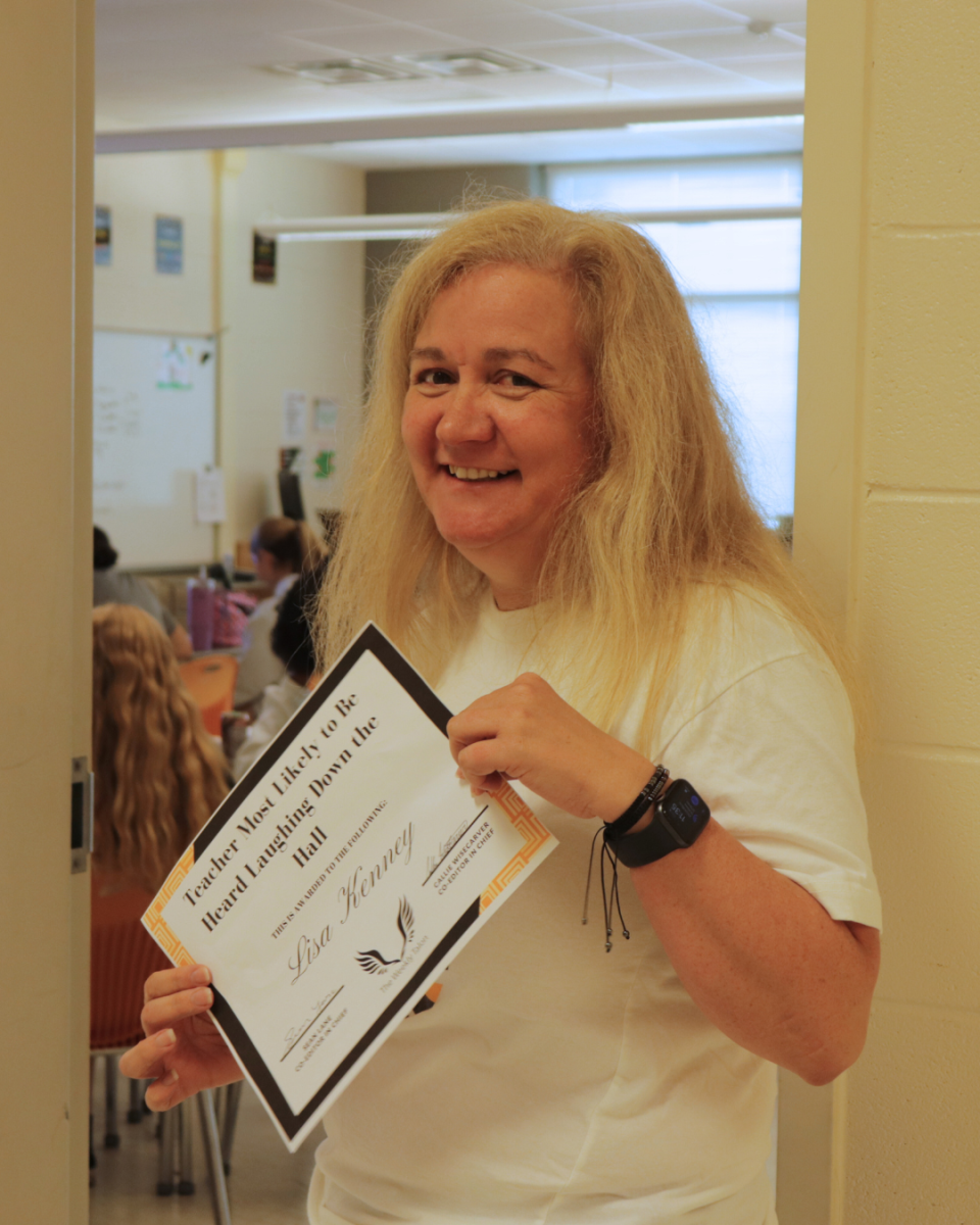 As she often integrates humor into her lessons and classroom conversations, math teacher Lisa Kenney can frequently be heard laughing at her jokes (and her students). 