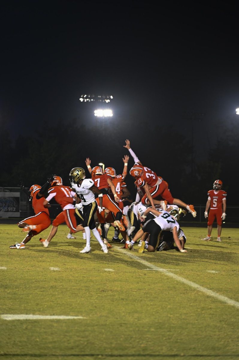Austin Heath, Jathan Redmond, Elijah Chaffin, and Max Cornatzer attempt to block a field goal kicked by Pinecrest's punter.