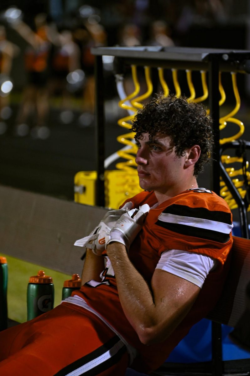Gavin Reece sits on the bench following a missed catch, leading to an end of Davie’s possession.