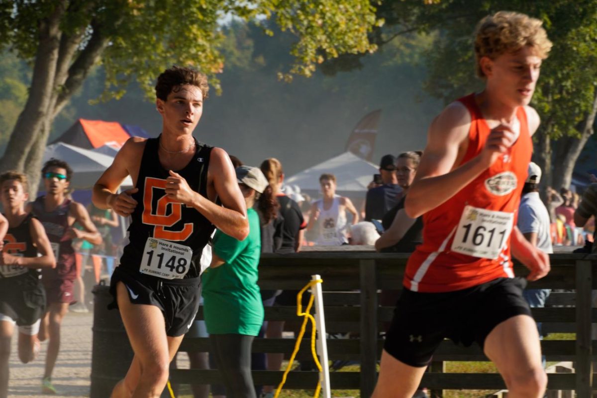 Ethan Lakey chases down an opponent at the Hares & Hounds Cross Country Invitational