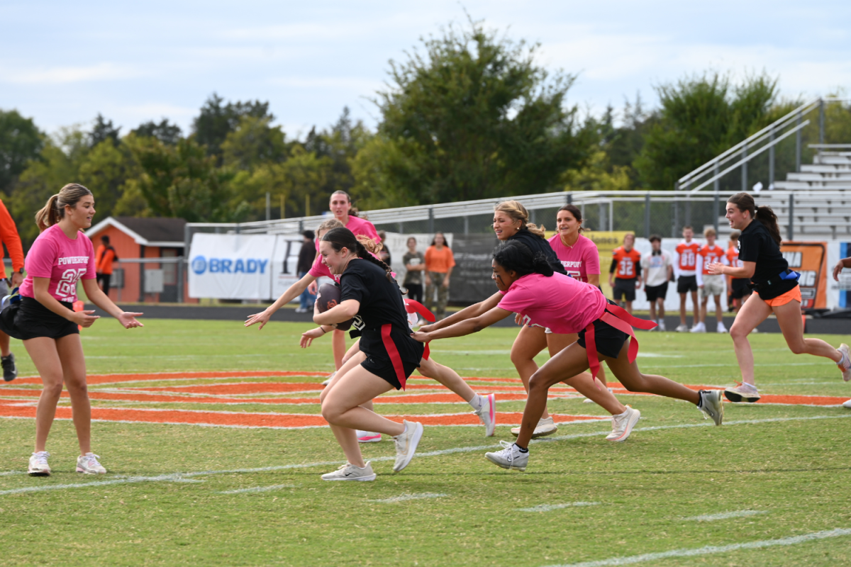Senior Precious Jimerson narrows in on an opposing player, junior Madison Daugherty, during the Powder Puff game.