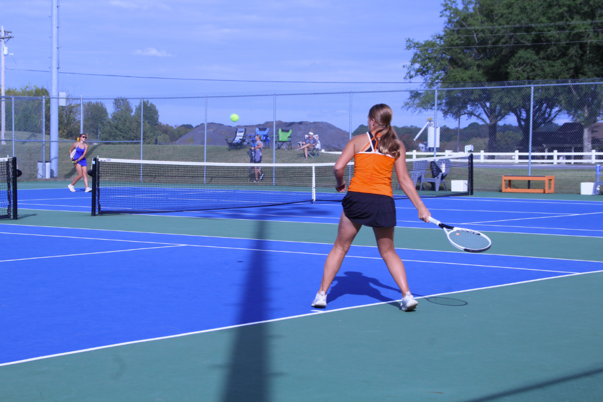 Sophomore Kate Chaffin hits a forehand shot to her opponent.