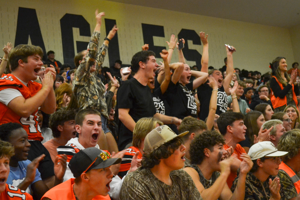 Davie’s Junior section uses the all of their voice-power to win the sound of spirit contest.