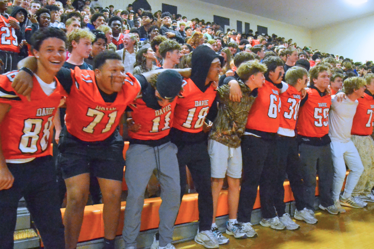 Freshmen boys “Swag-Surfin” during one of the many band performances of the pep rally