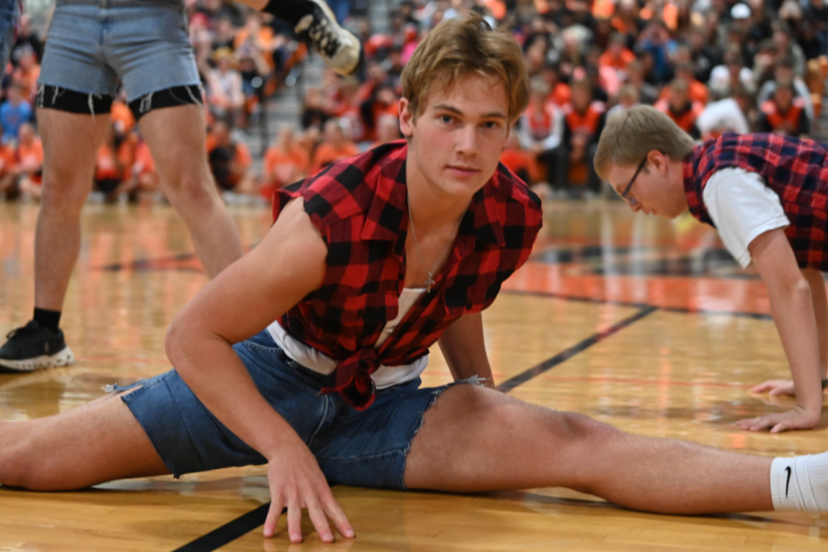 Senior Luke Wayne lands in a split during his Mancing Boots performance.