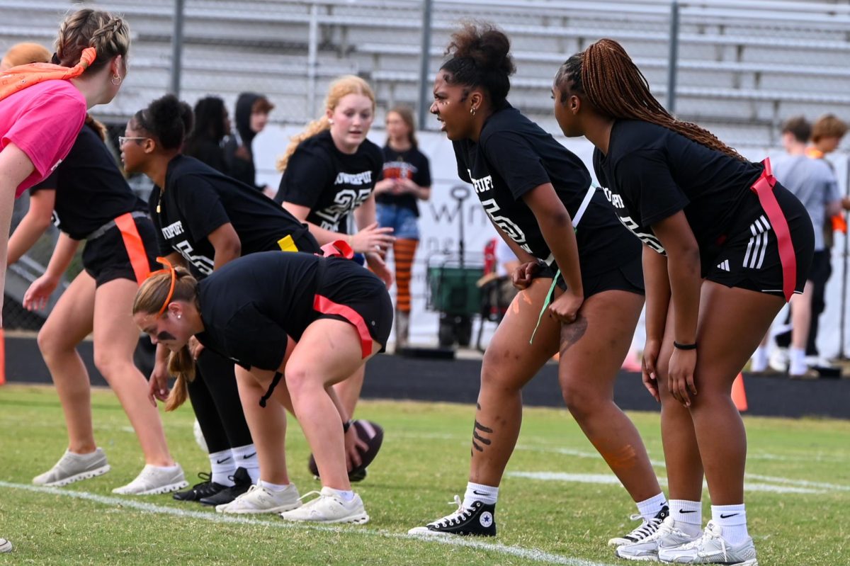 The Black Team prepares for their drive at the line of scrimmage during the Powder Puff Football Game
