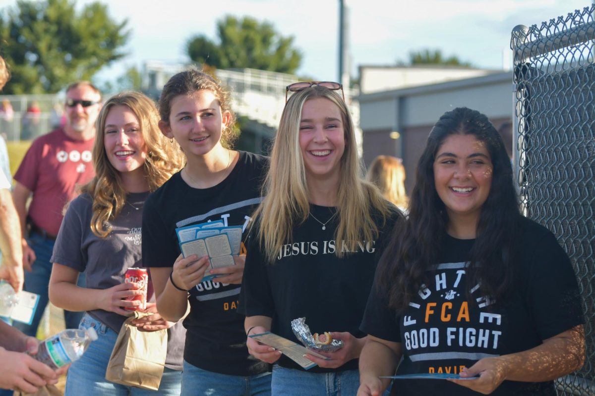 After having the opportunity to get the food provided by Farmington Baptist Church, attendees were greeted at the gates to War Eagle Stadium by student Fellowship of Christian Athletes (FCA) leaders. The student leaders are an integral part of Fields of Faith; they have the opportunity to give a talk or testimonial during the night, and they help run the event by serving as greeters and welcoming attendees.
