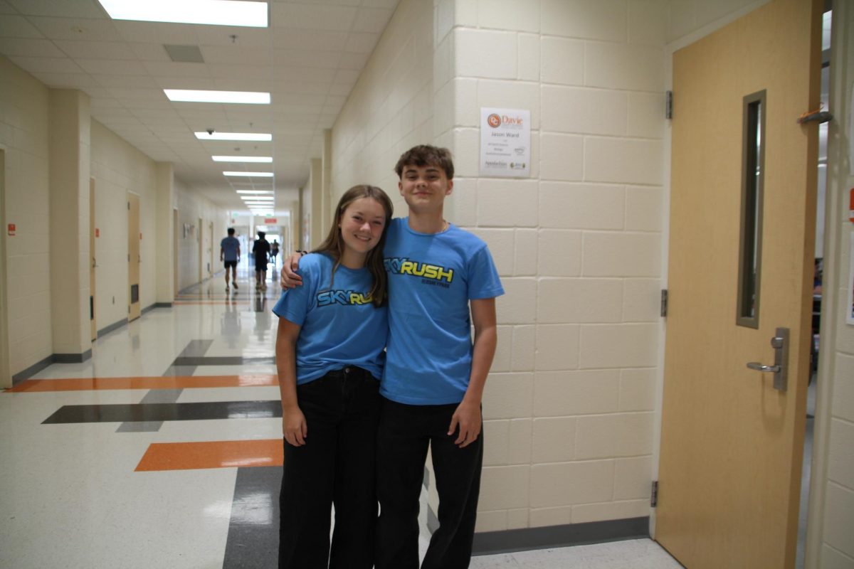 Freshmen Ryan Richardson and Grace Turner twin with their sky rush shirts and black pants. 