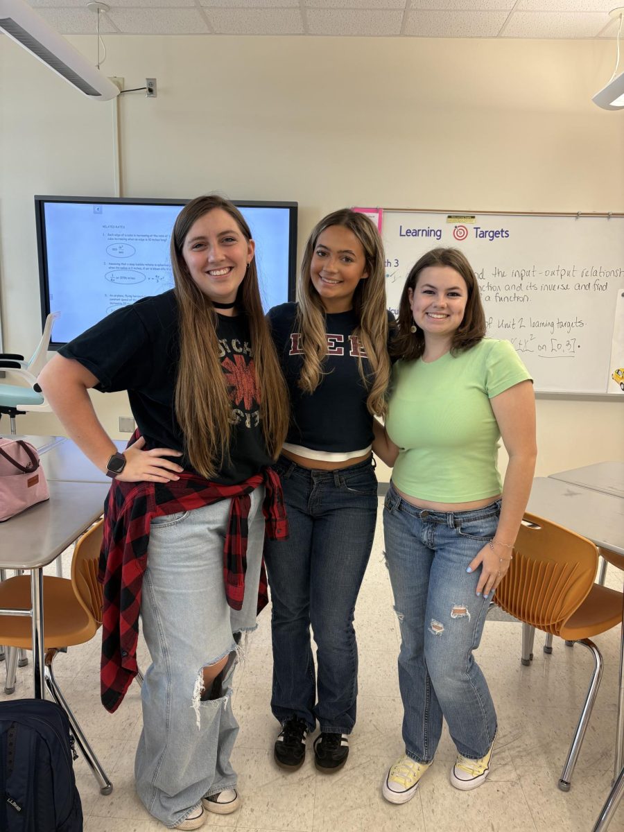 Senior Zoe Hendrix, Riley McNeil, and Junior Cassidy Eggers are dressed in their best 90s and 2000s outfits for the perfect throwback.