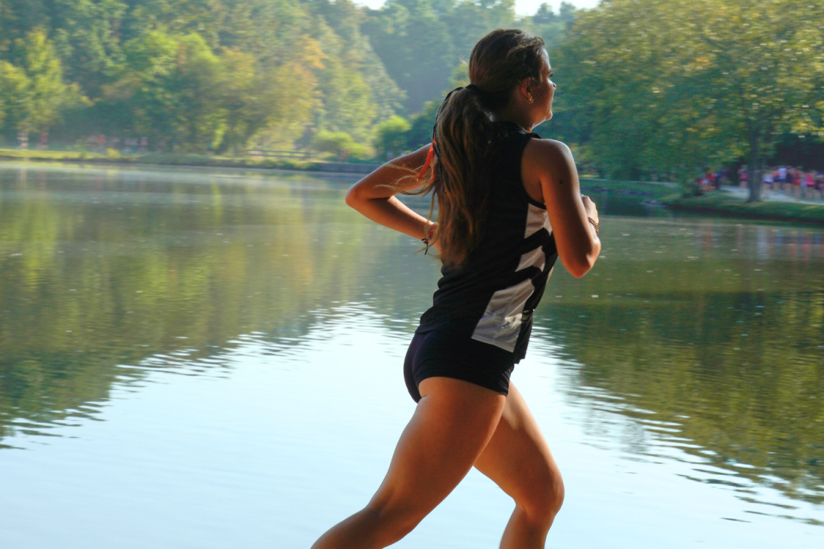 Lexi Marion extends the length of her stride as she pushes through towards the finish line of the race. 