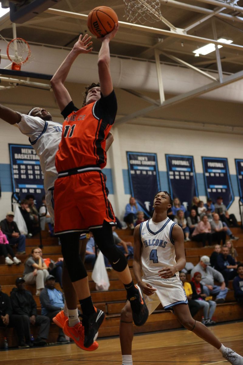 Junior Aiden Horton, rising above West Rowan's defense scoring two points for the War Eagles.  