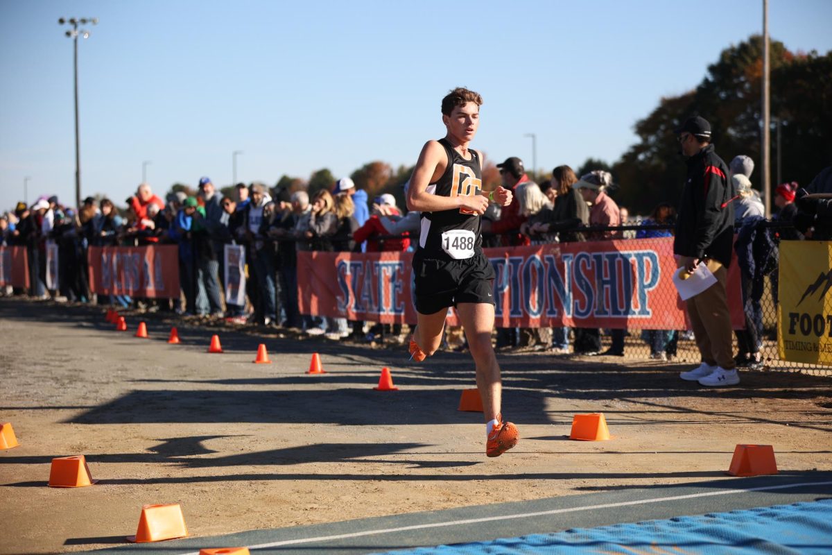Ethan Lakey speeds up as he approaches the finish line, enlongating his strides to make the final distance smaller. 