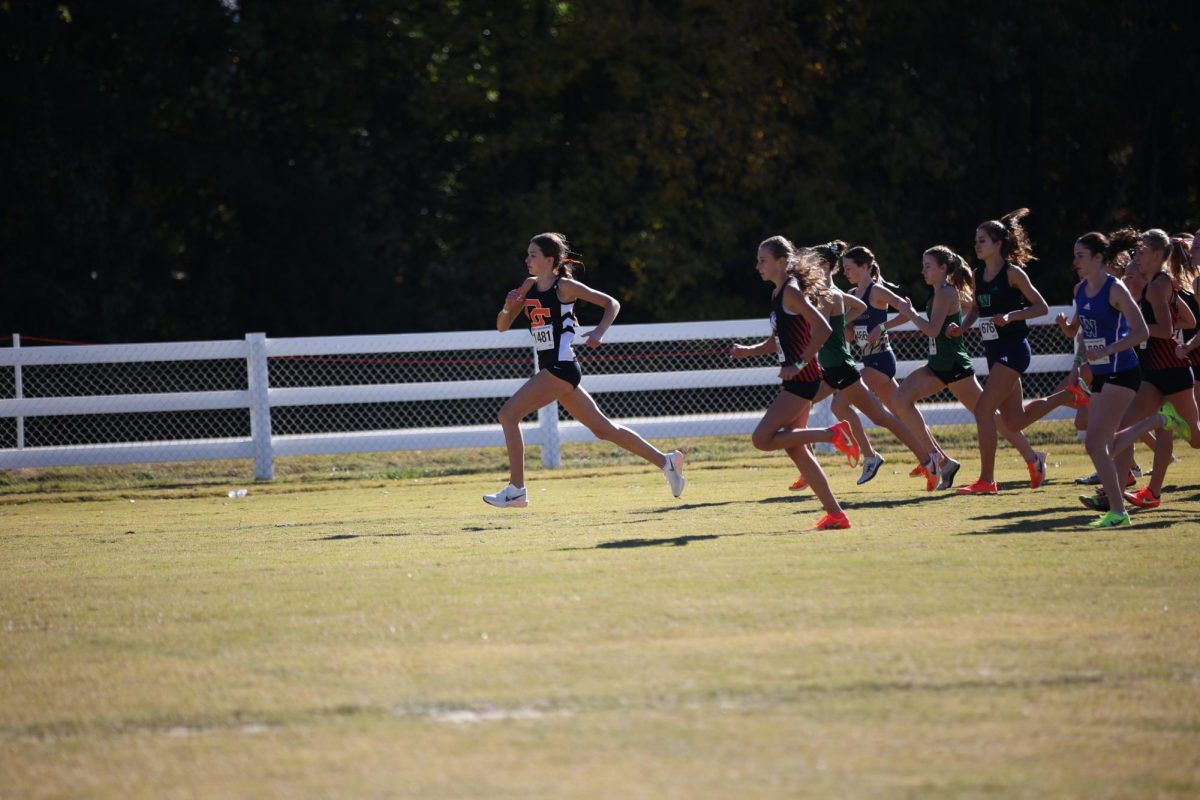 As the gun blows marking the start of the race, Kirsten Starkey starts her race blowing ahead of the competition. 