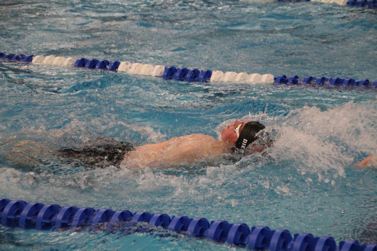 Junior Ethan Diemer races into the wall, starting the Men's 200 Medley Relay off. 