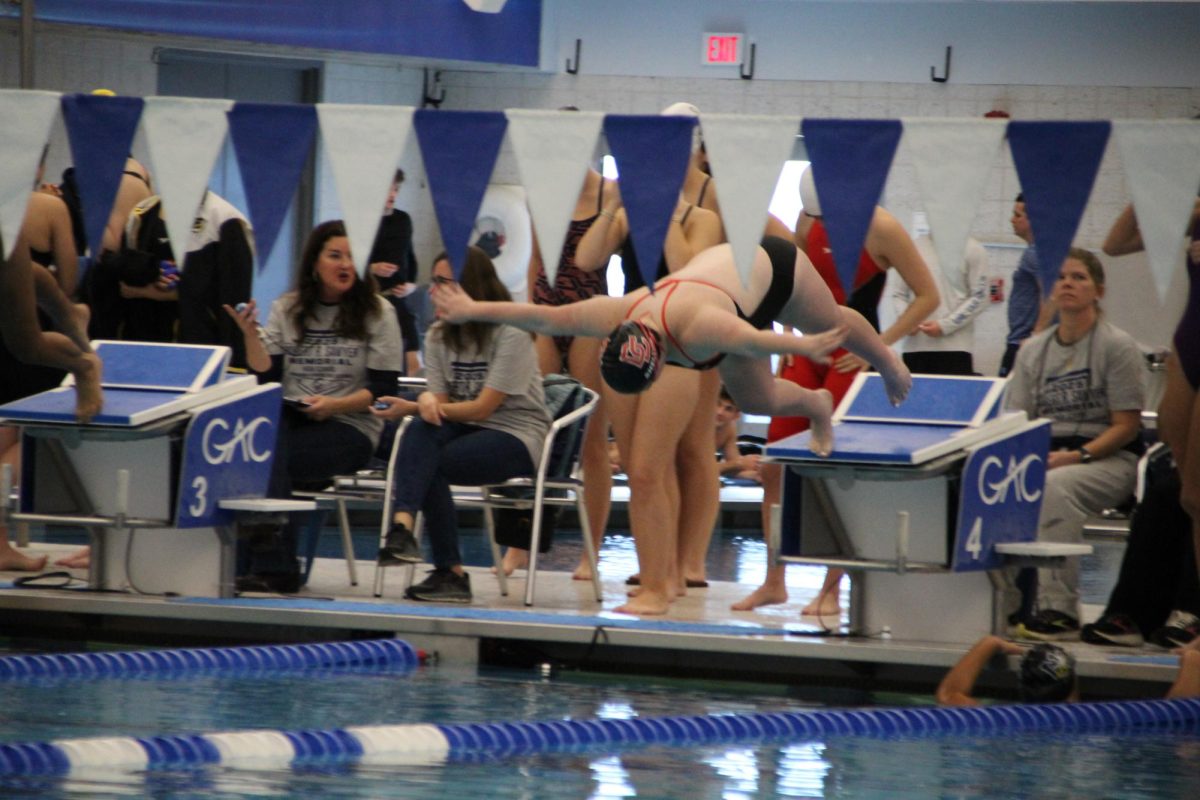 Junior Marion Shelton dives off the block heading into her 50 freestyle.