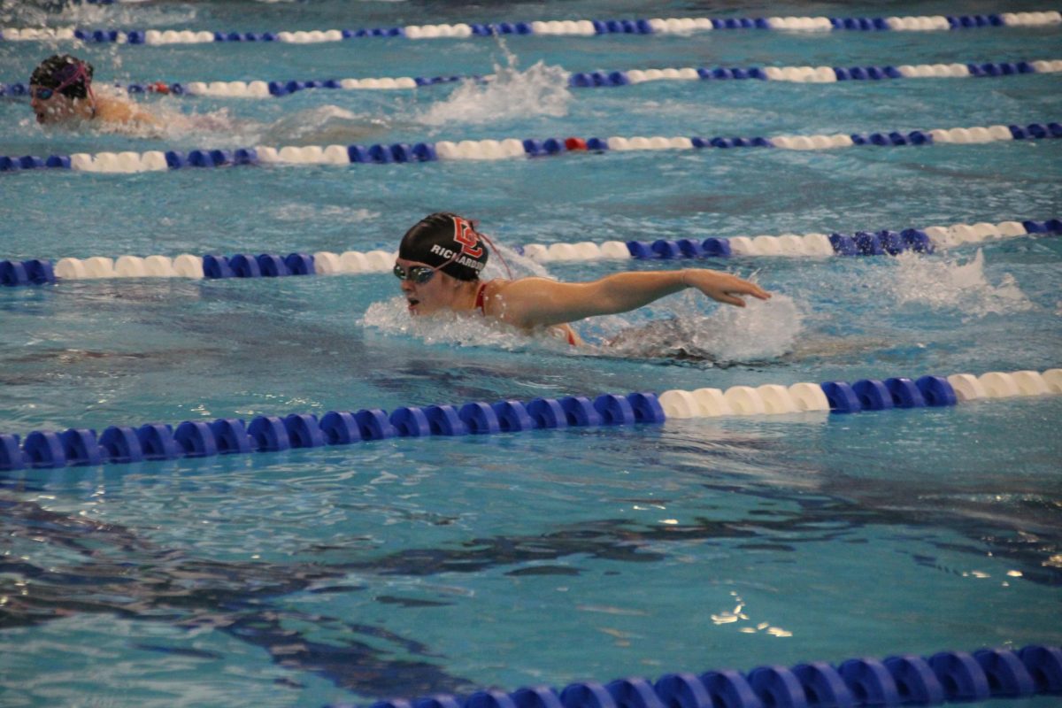 Junior Kayden Richardson takes a breath during her 100 butterfly. 