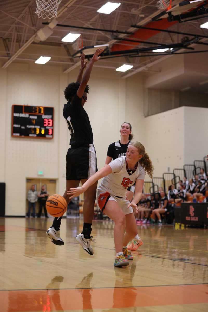 Assisting Sophomore Olivia Smith, Junior Emmie Burris cuts behind the defense approaching the end of the 4th quarter.