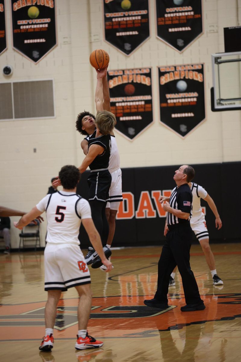 Beginning the game, Sophomore Noah Dulin sets the tip-off, preparing the War Eagles for a prominent game against the Ledford Panthers.