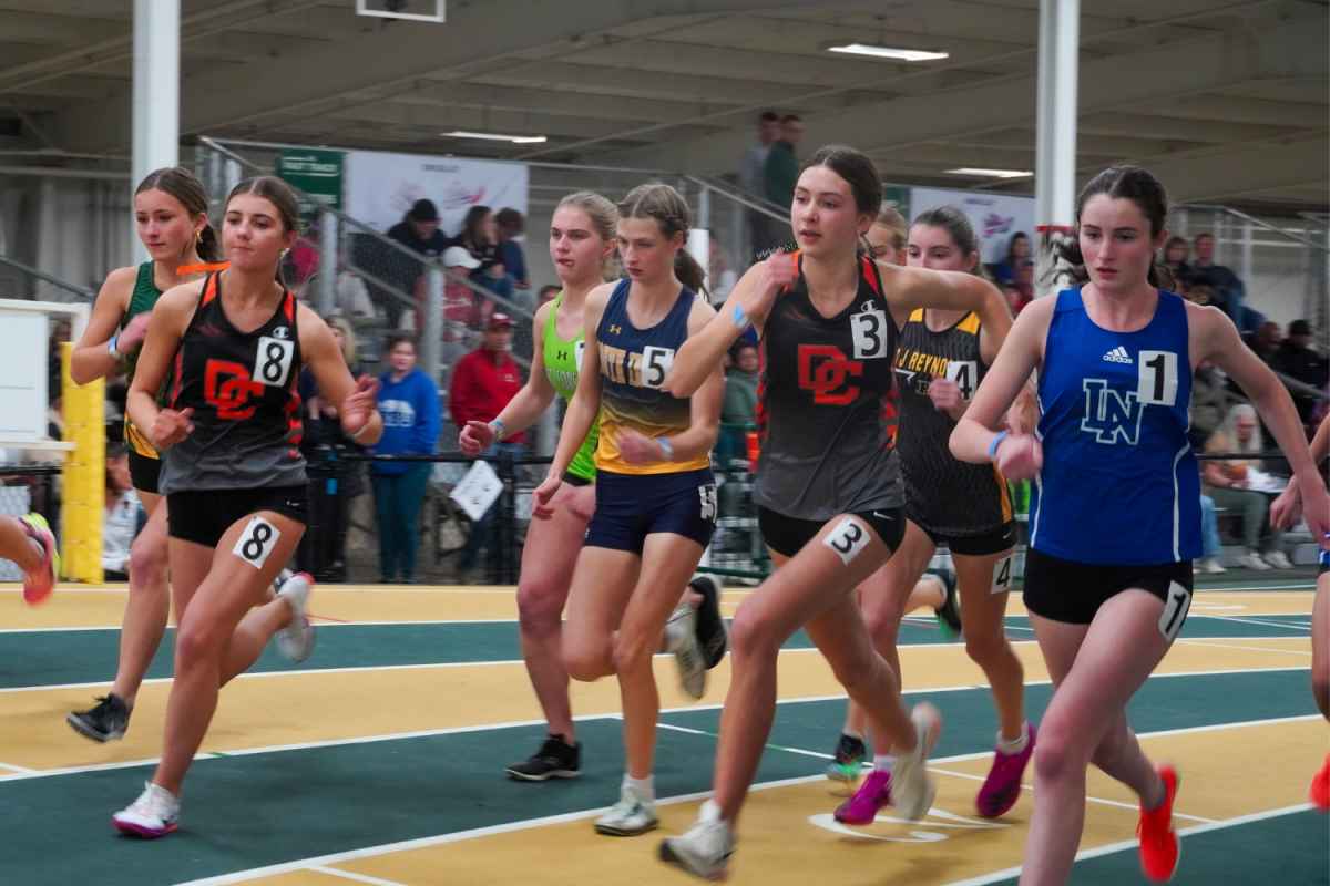 Davie athletes round the curve at JDL Fast Track in Winston-Salem during the NPC Conference Championship.