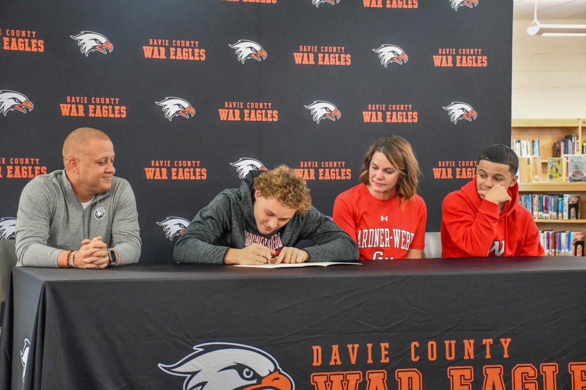Ethan Driver puts pen to paper as he signs to play Division One football at Gardner-Webb. 