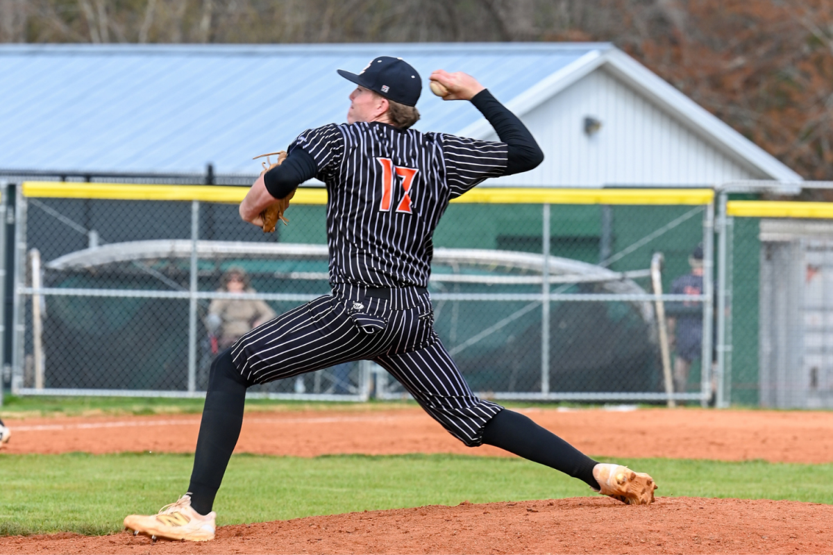 Ty Sain pitches the ball hoping to strike out the opposing batter. 