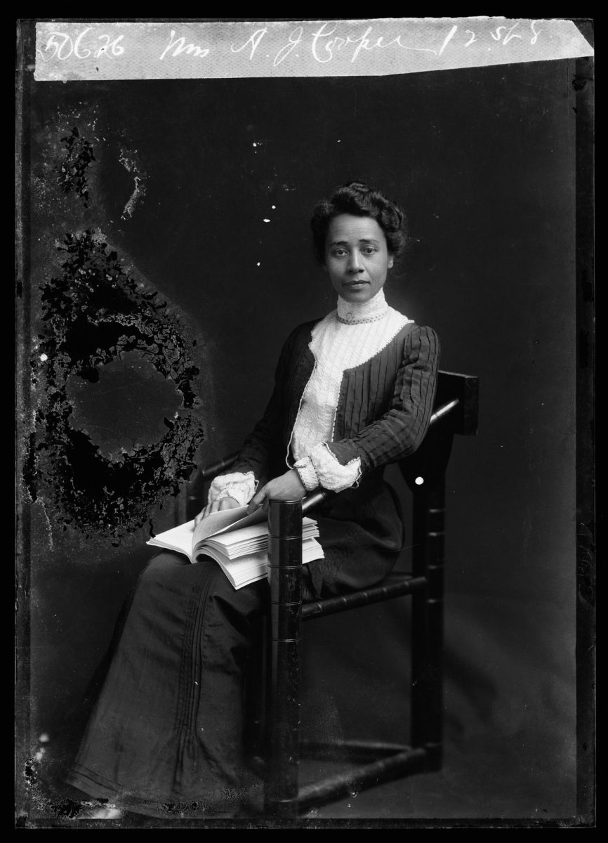 Anna Julia Cooper is seated with a book in her lap. | C. M. Bell, Public domain, via Wikimedia Commons