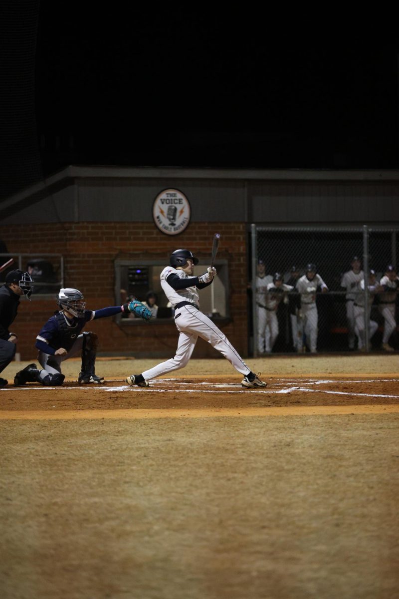 Junior Hayden Potts completes the swing after making contact with the ball. 