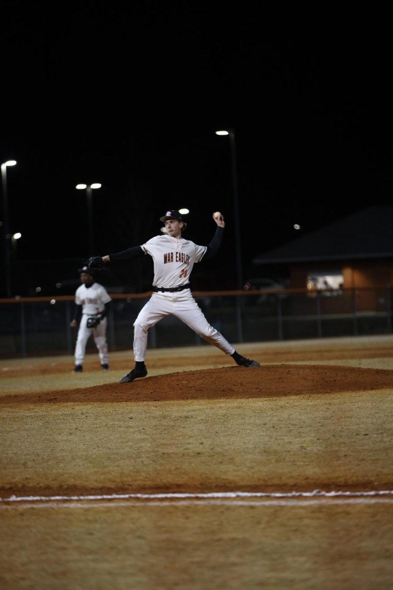 Senior Brice Wilson winds up ready to make the pitch to start the play. 