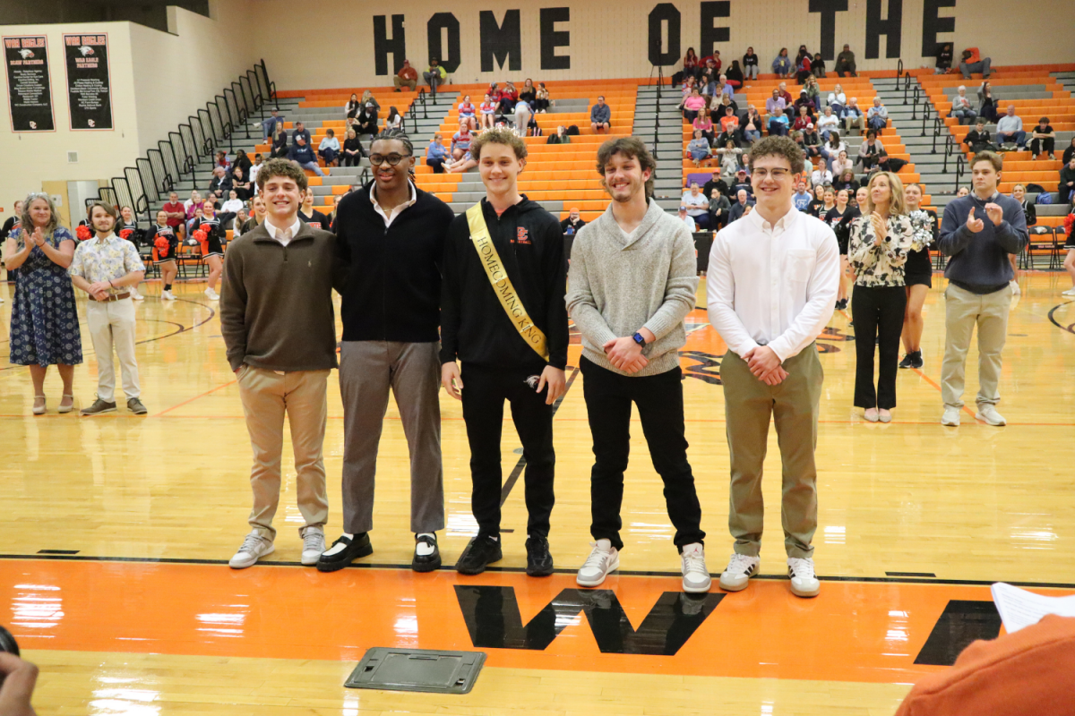 Homecoming King Ethan Driver stands with his fellow nominees to the 3rd Annual Davie High "Hoopscoming" Court