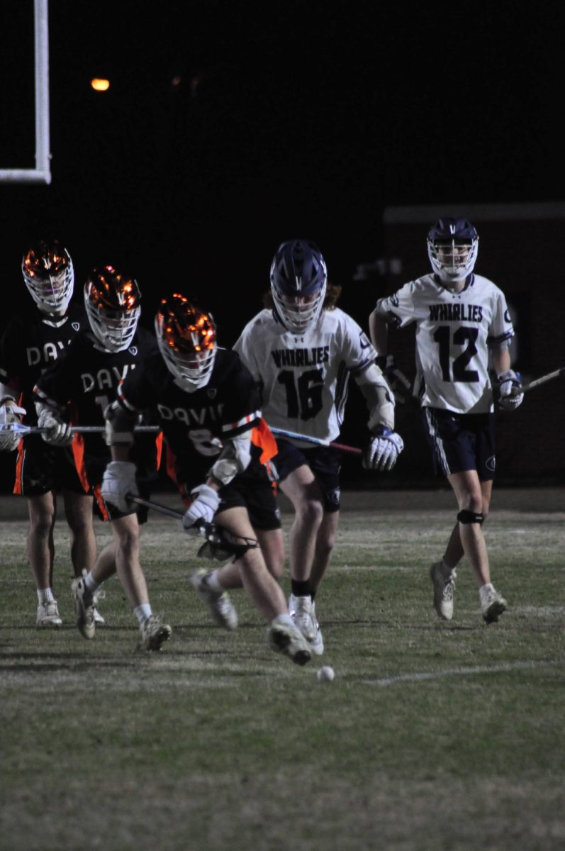 Senior Owen Blakley outruns his opponents to get to the ground ball. 